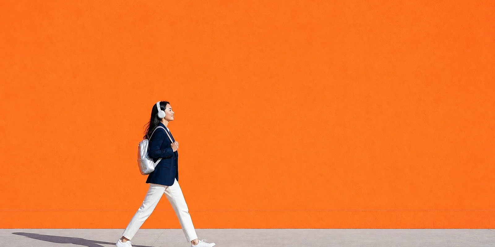 Teaser: Culture and Values A woman walking on a colored street, representing GFT's culture and values