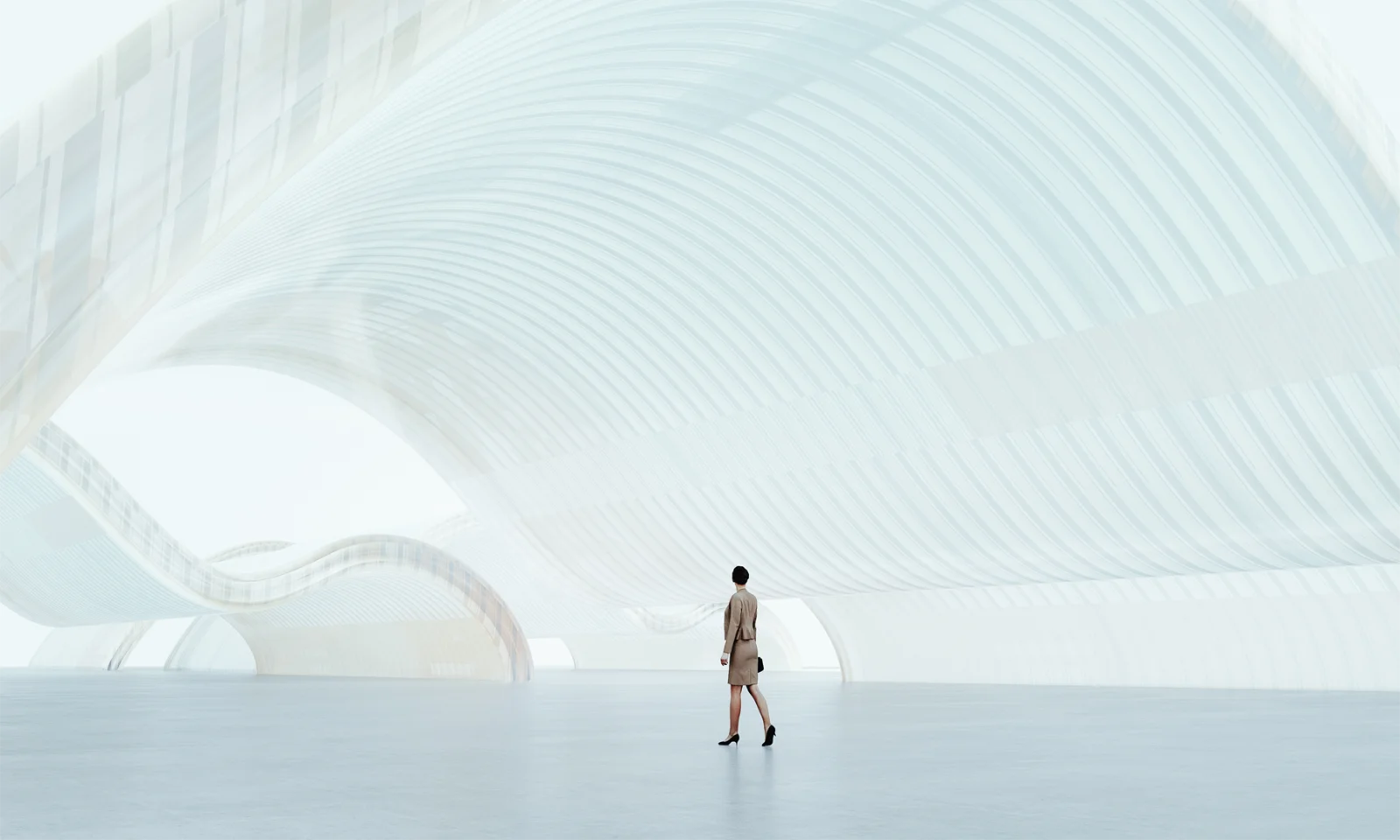 E-Book Guidewire Beyond Implementation Person walking through a futuristic, light-filled architectural space, symbolizing innovation, vision, and digital progress.