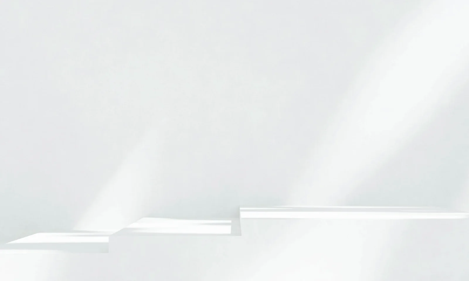Abstract white staircase with clean lines and soft natural shadows on a bright background, creating a sense of calm and elevation