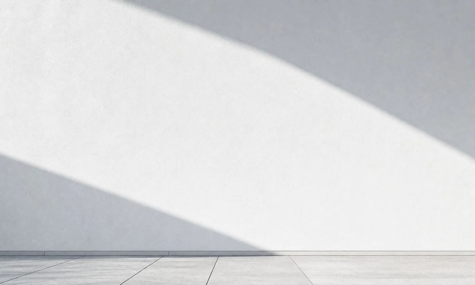 GFT Image: UX Abstract composition featuring soft diagonal beams of light and shadow across a smooth white and gray gradient background.