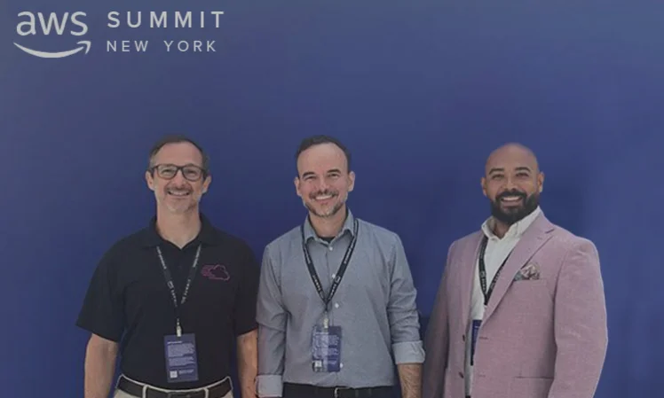 AWS Summit New York 2024 GFT team members attending AWS Summit New York 2024, standing in front of a blue backdrop with the AWS Summit logo.
