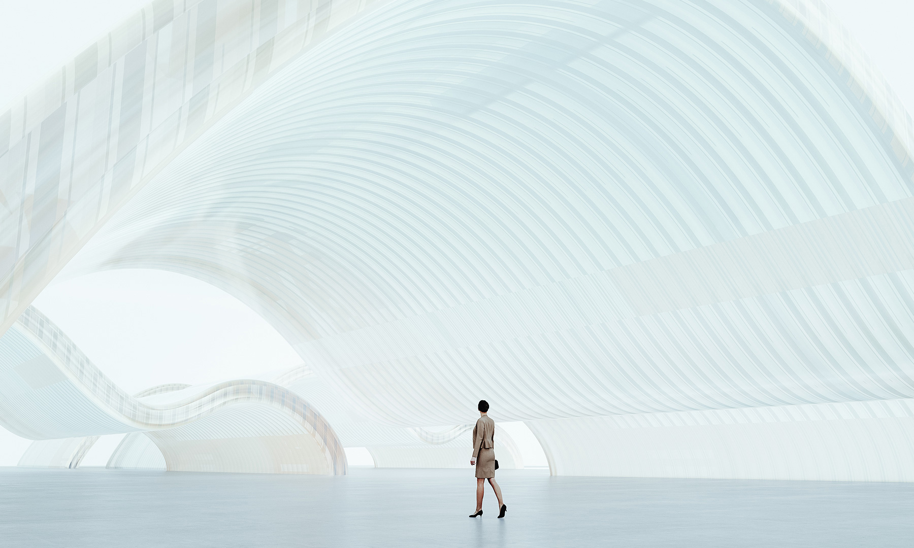 Woman walking through a bright, futuristic architectural space with curved structures, symbolizing innovation, digital transformation, and forward-thinking design.