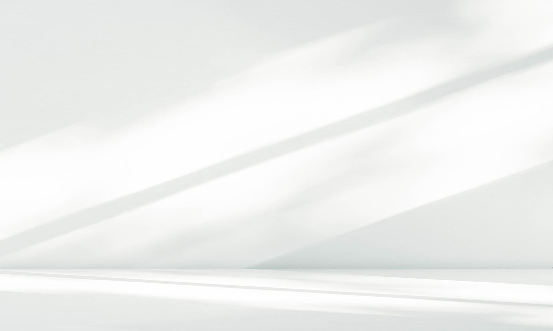 GFT Solution: Azure Cloud Security Audit Bright diagonal beams of sunlight casting smooth, elongated shadows across a clean white wall and floor in a minimalist interior setting