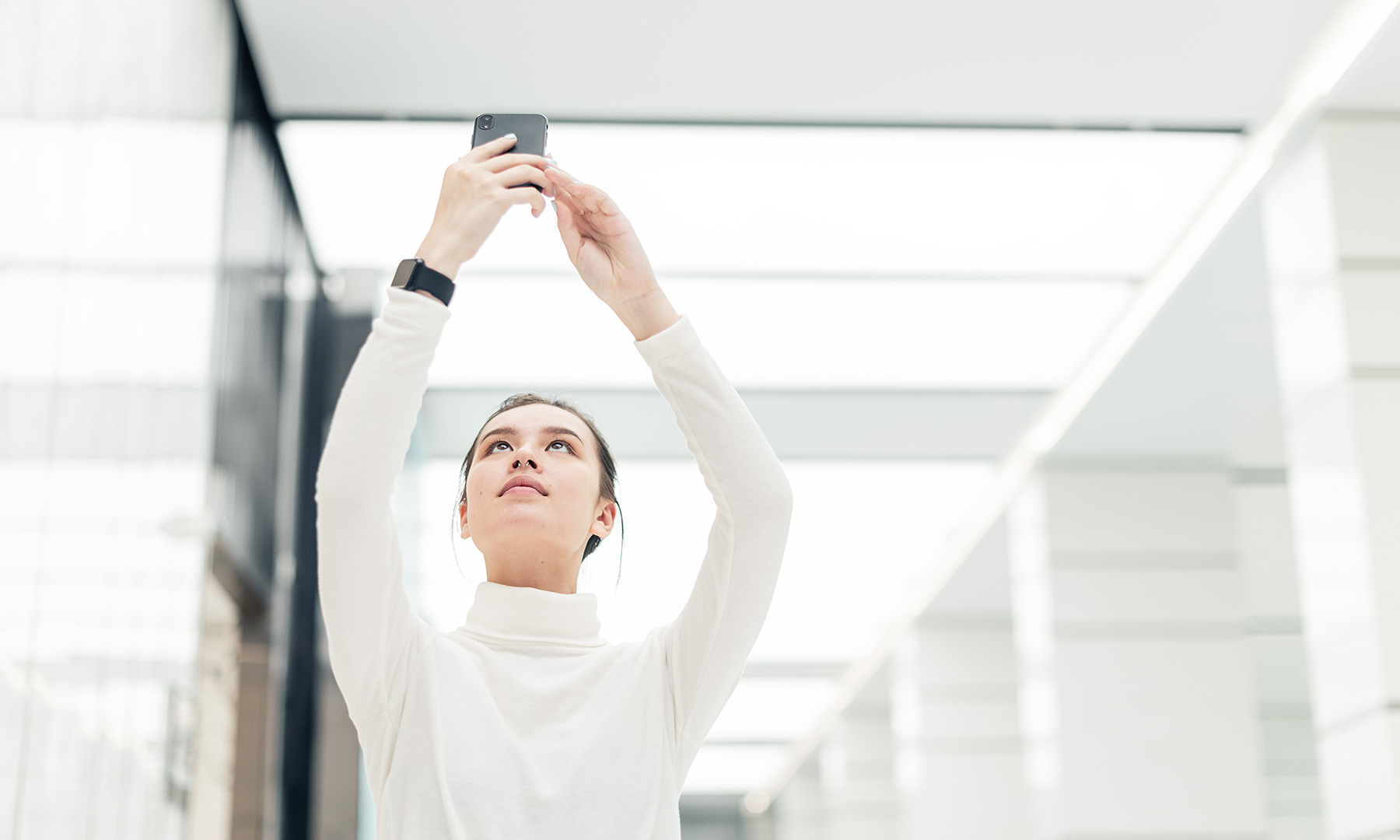 Professional Using Smartphone in Bright Modern Office gft-image-mood-17.jpg